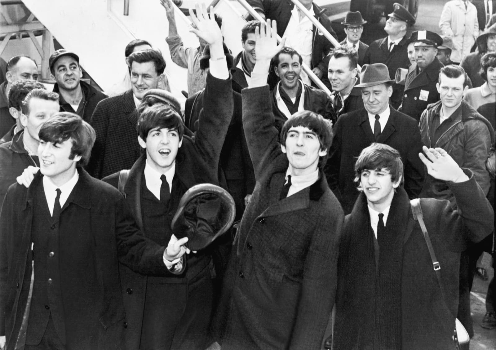 The Beatles wave on arrival at New York’s Kennedy Airport, February 1964
